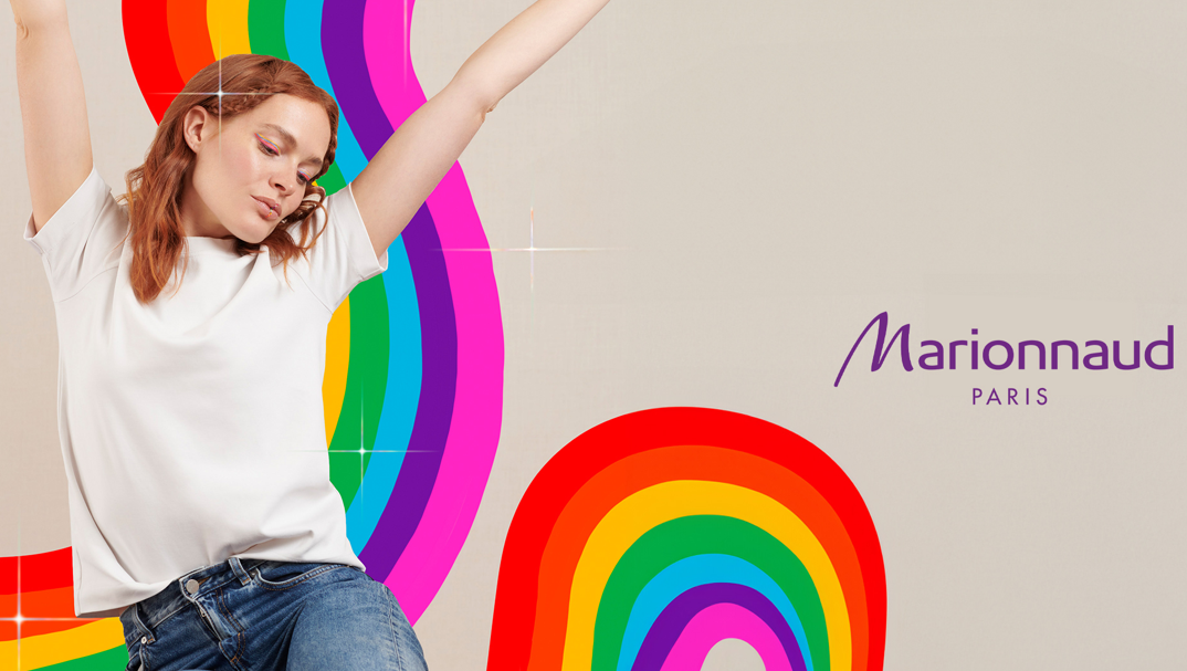 Woman with rainbow background, Marionnaud logo.
